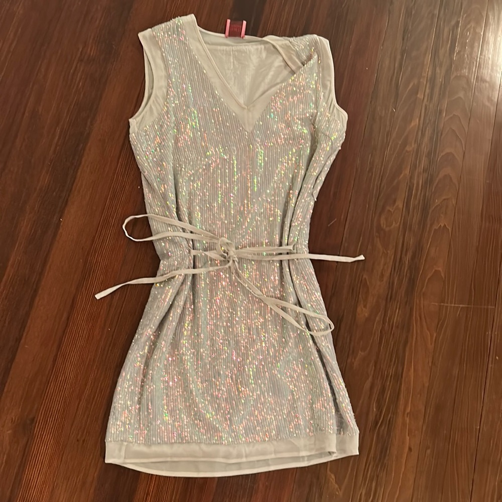 This is a silver sequined dress from Juliette Longuet in a size XS.